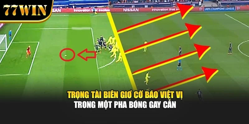 Trọng tài biên giơ cờ báo việt vị trong một pha bóng gay cấn